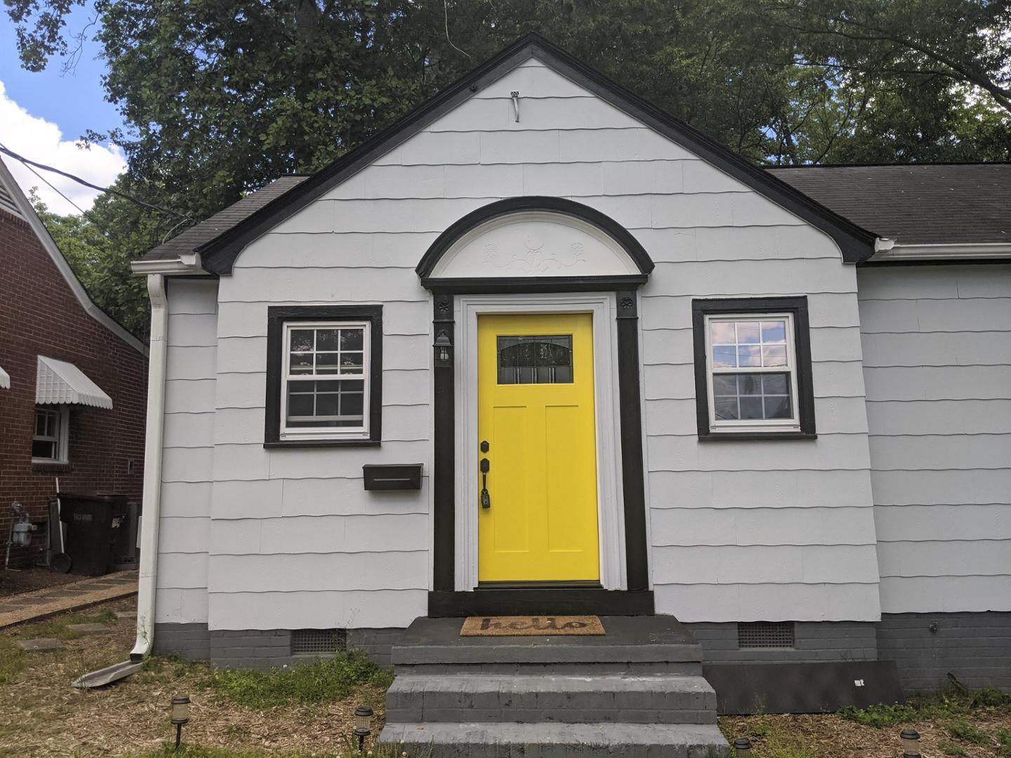 a front view of a house with a yard