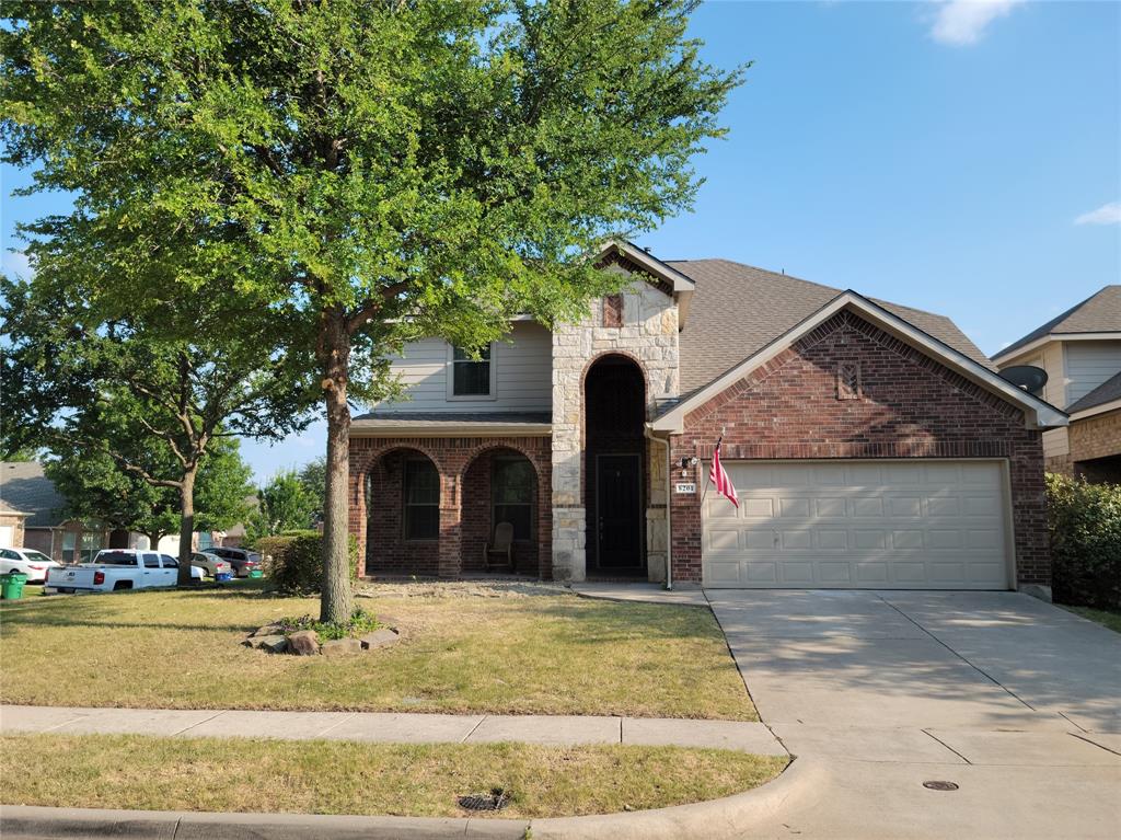 a view of front of house with a yard