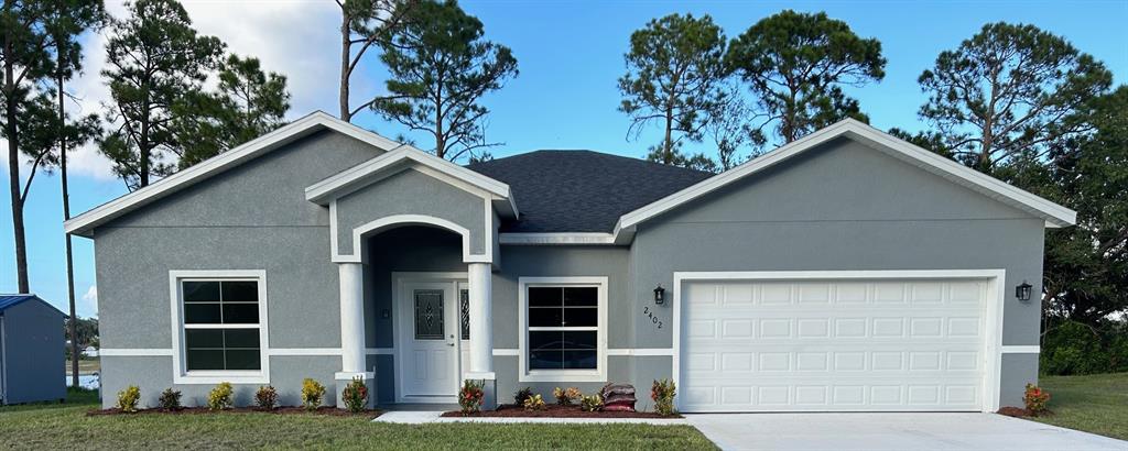 a front view of a house with a yard