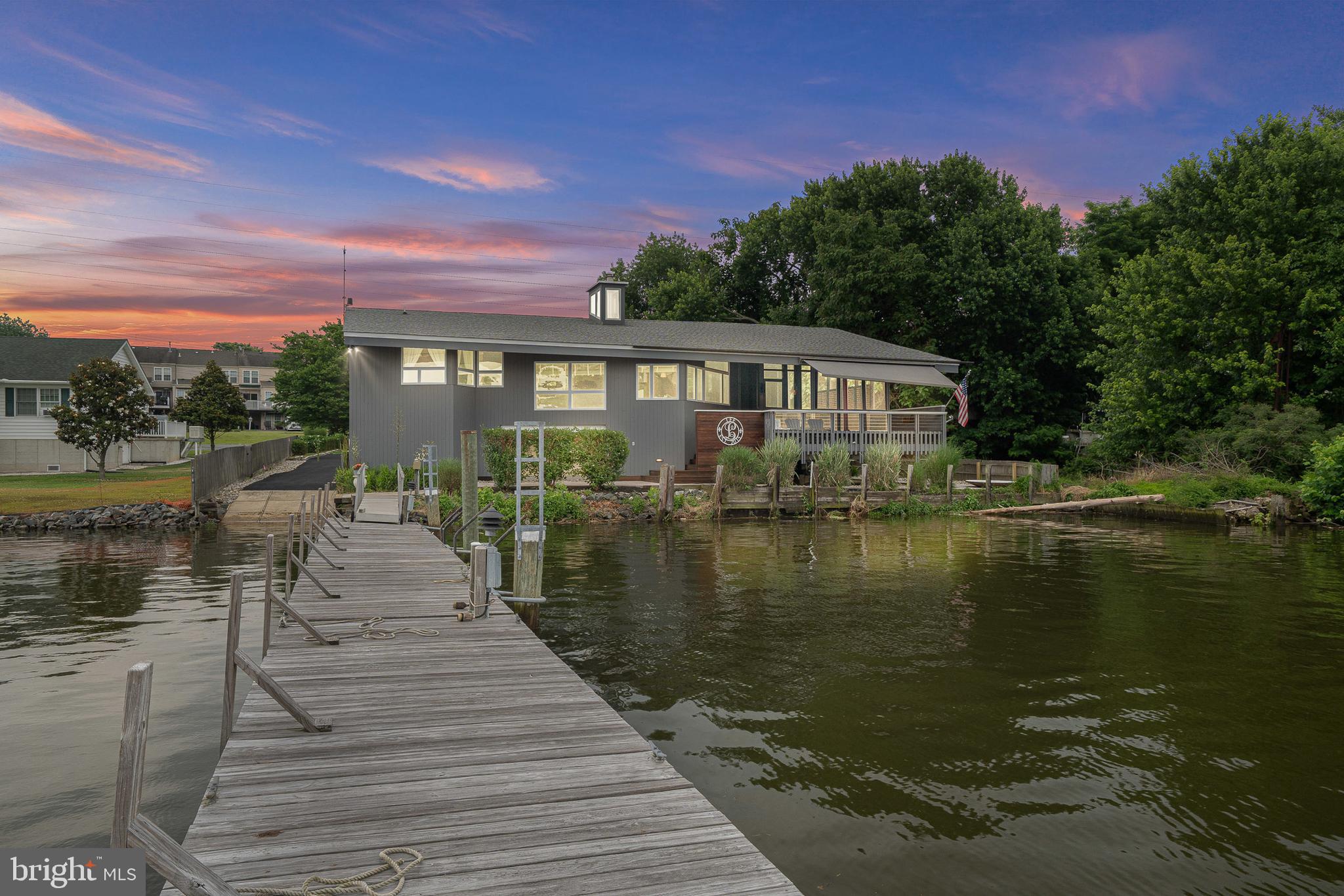 a view of a lake with a house in the background