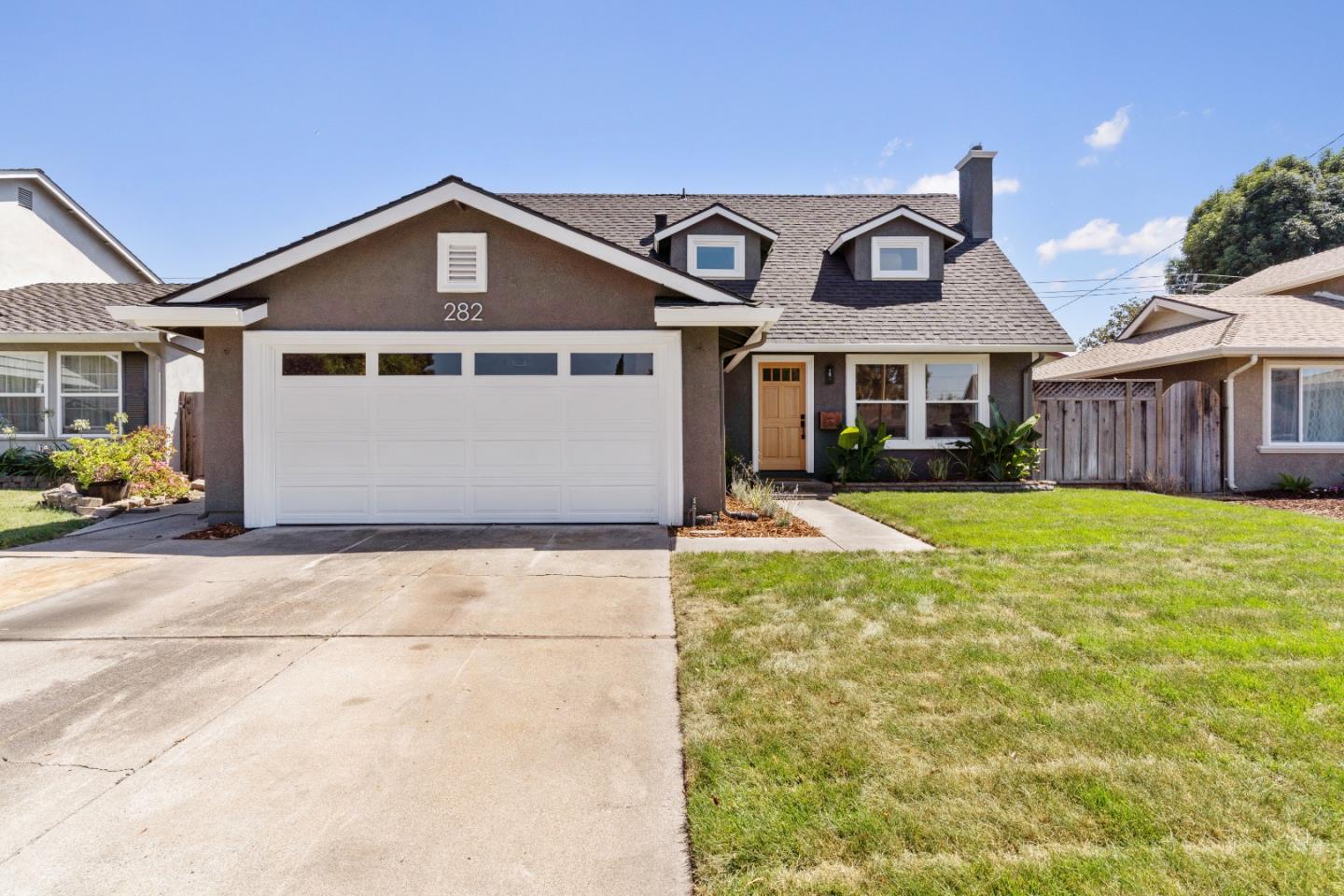 a front view of a house with a yard