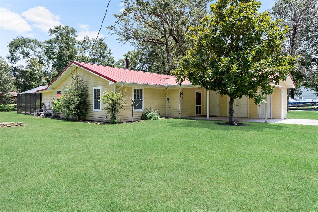 a front view of house with yard and green space