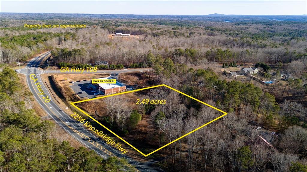 an aerial view of house with a yard