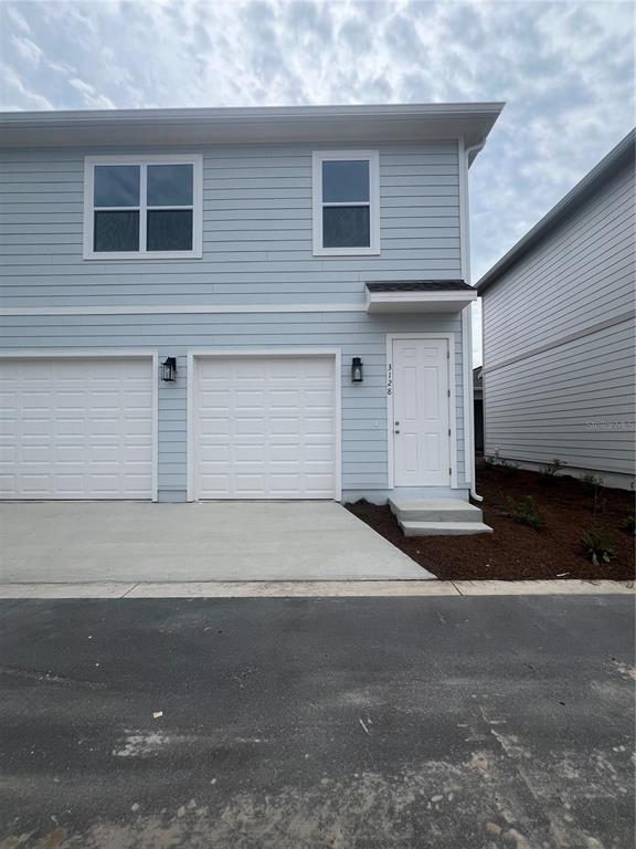 a front view of a house with a garage