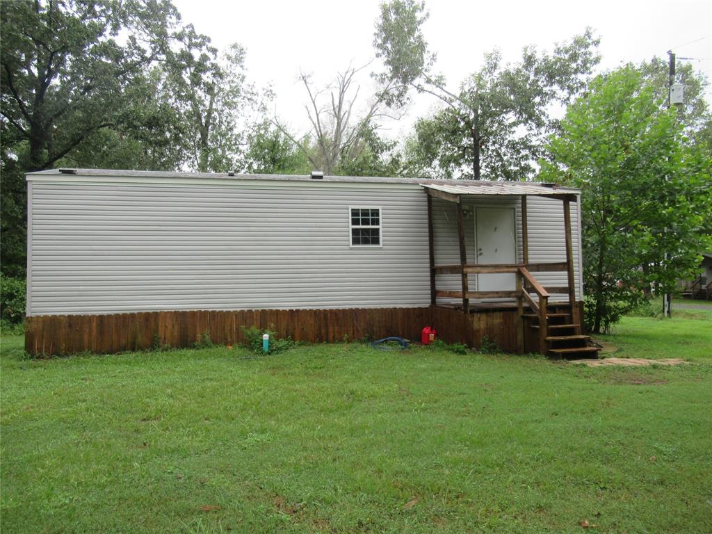 a view of a backyard with a sitting area