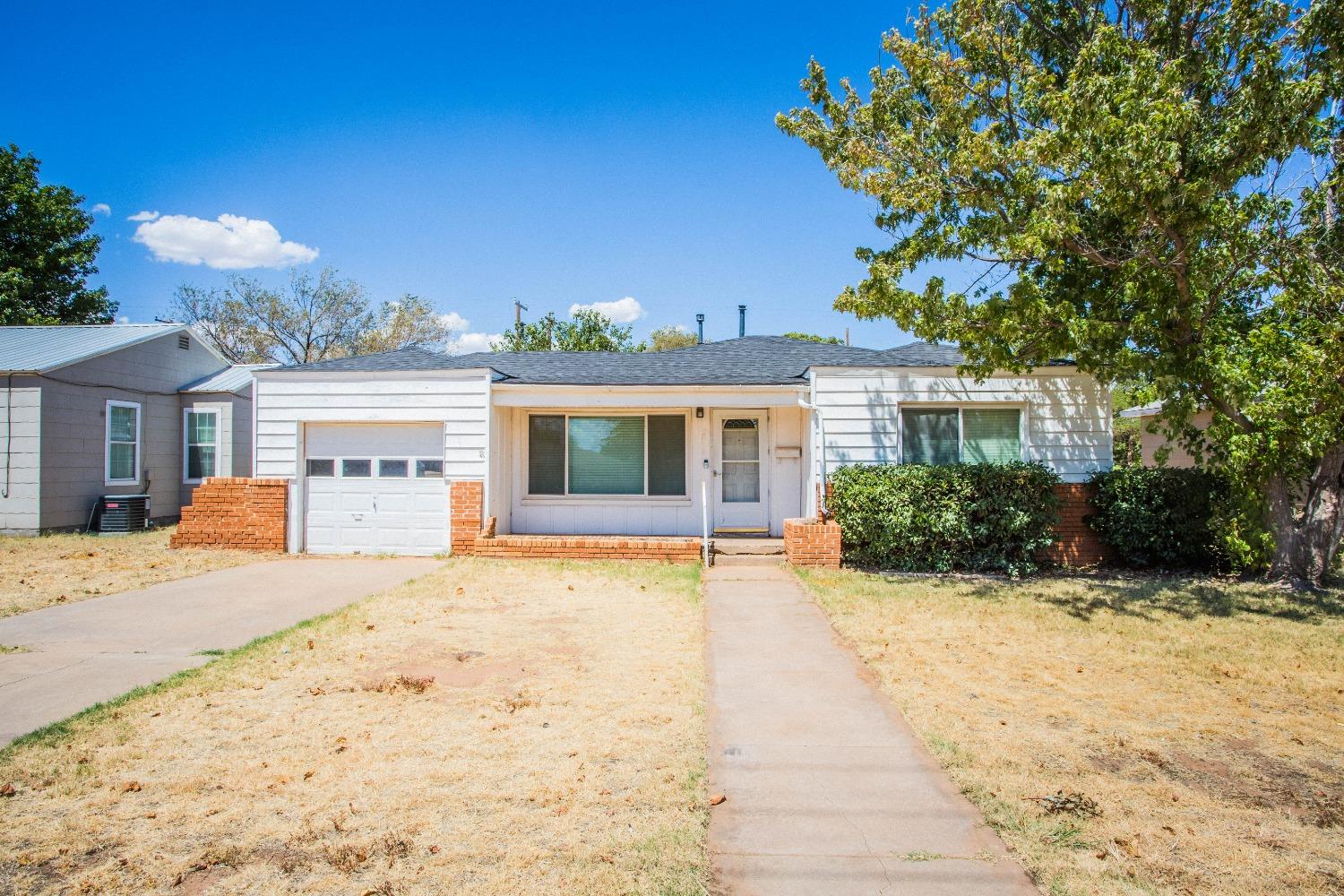 a front view of a house with a patio