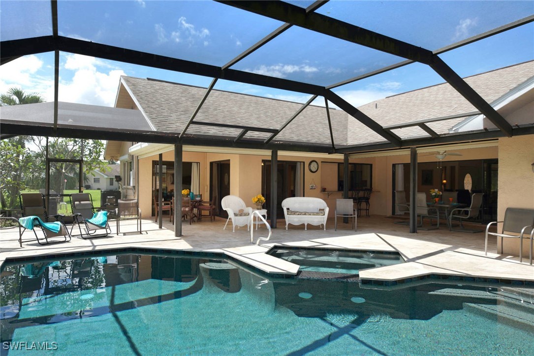 a view of swimming pool with outdoor seating