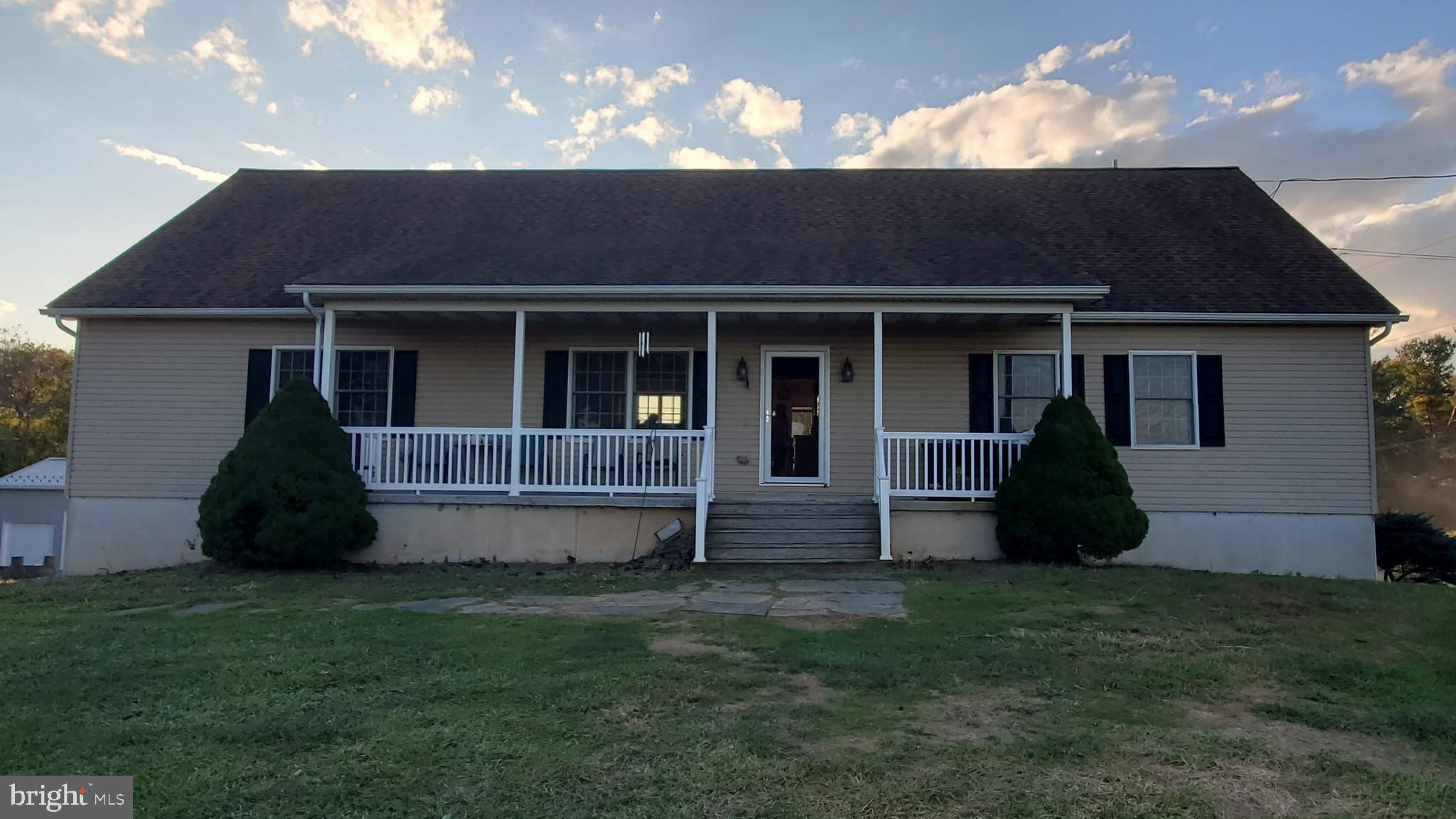 front view of a house with a yard