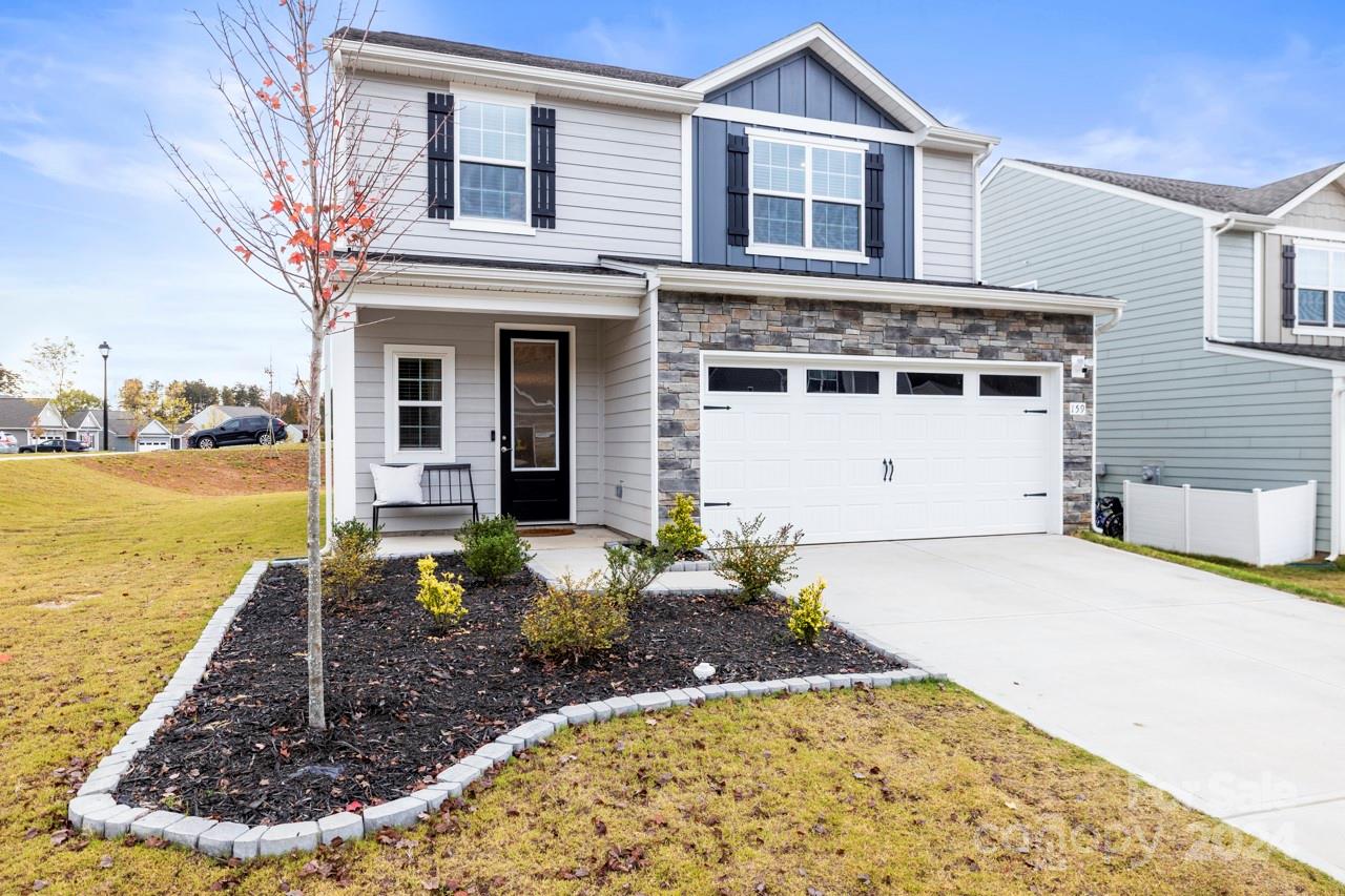 a front view of a house with a yard