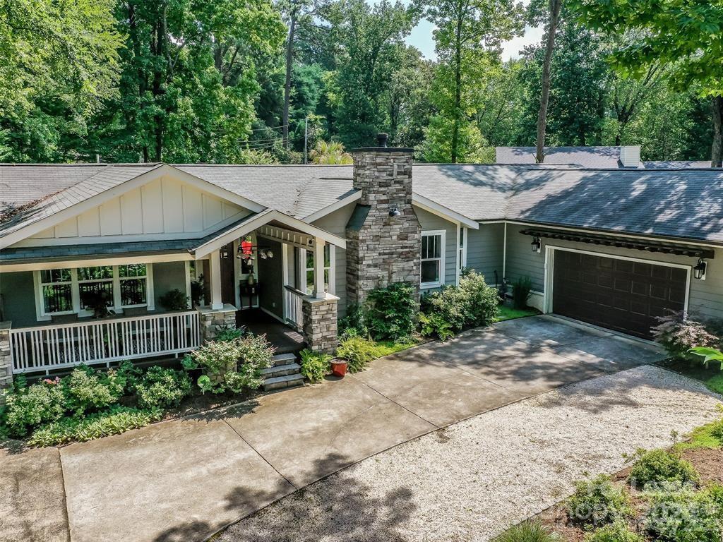 a aerial view of a house with a yard