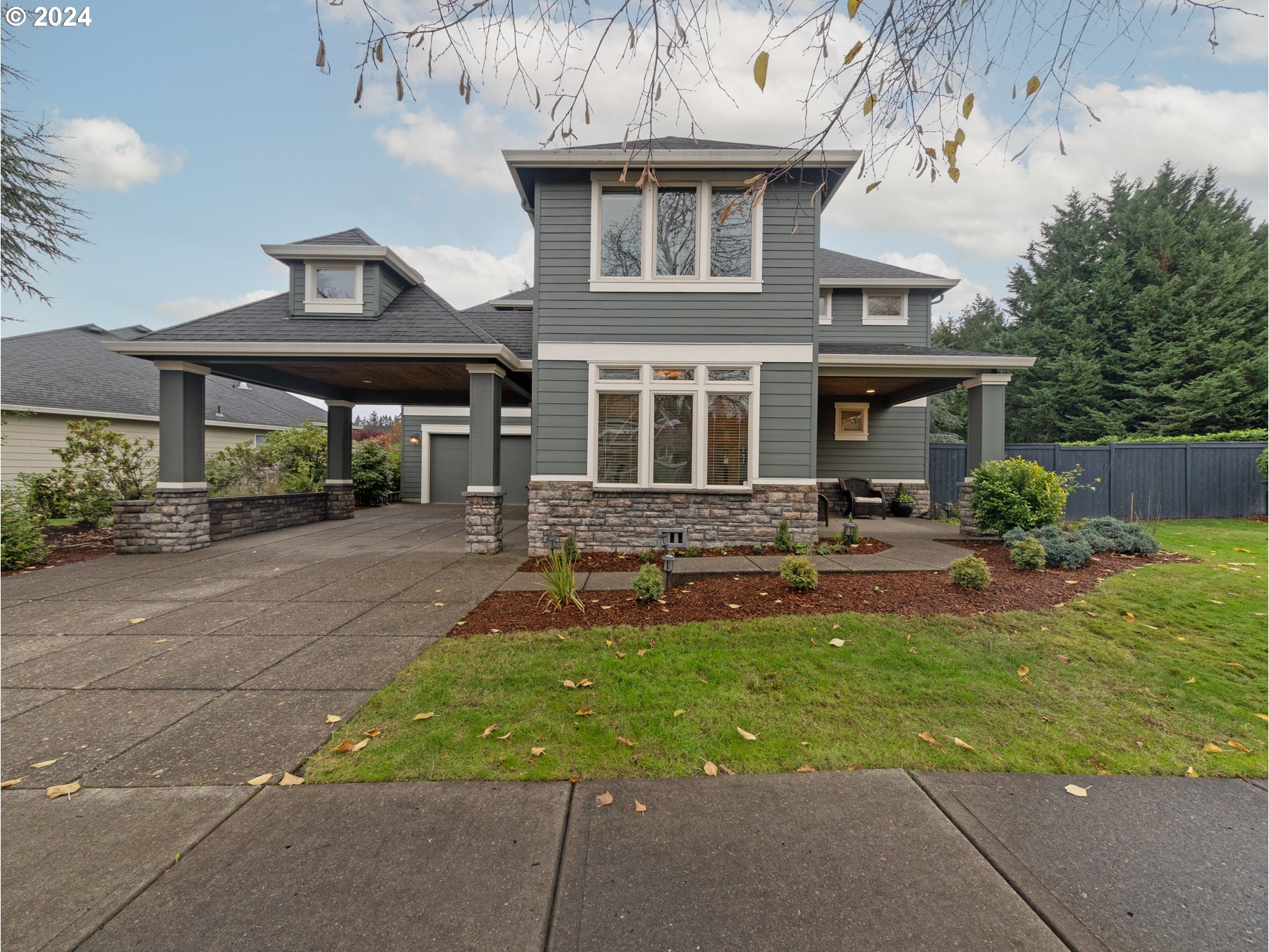 a front view of a house with garden