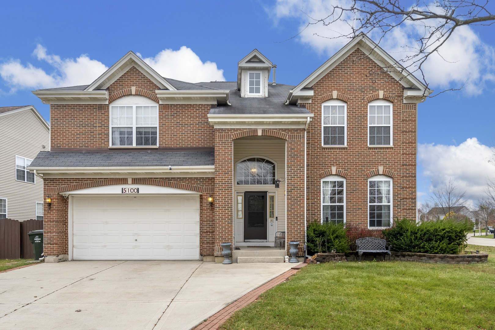 front view of a house with a yard