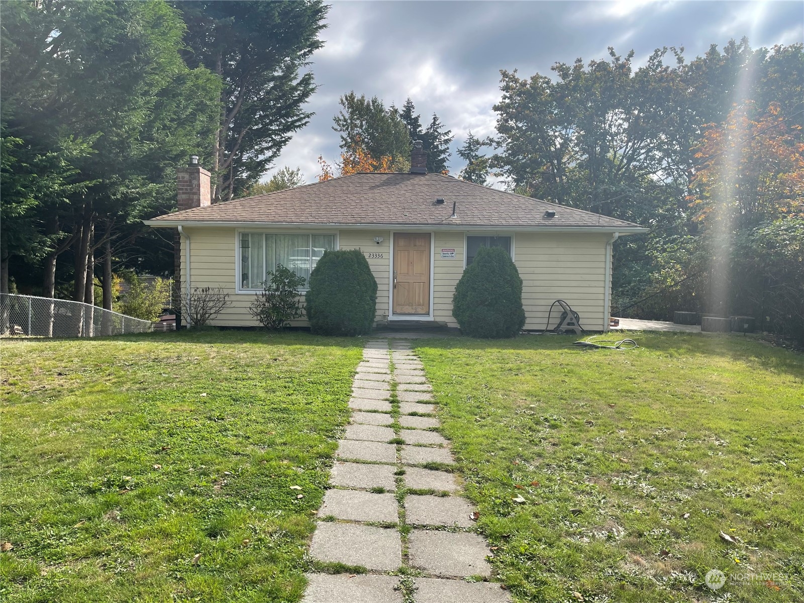 a front view of a house with yard