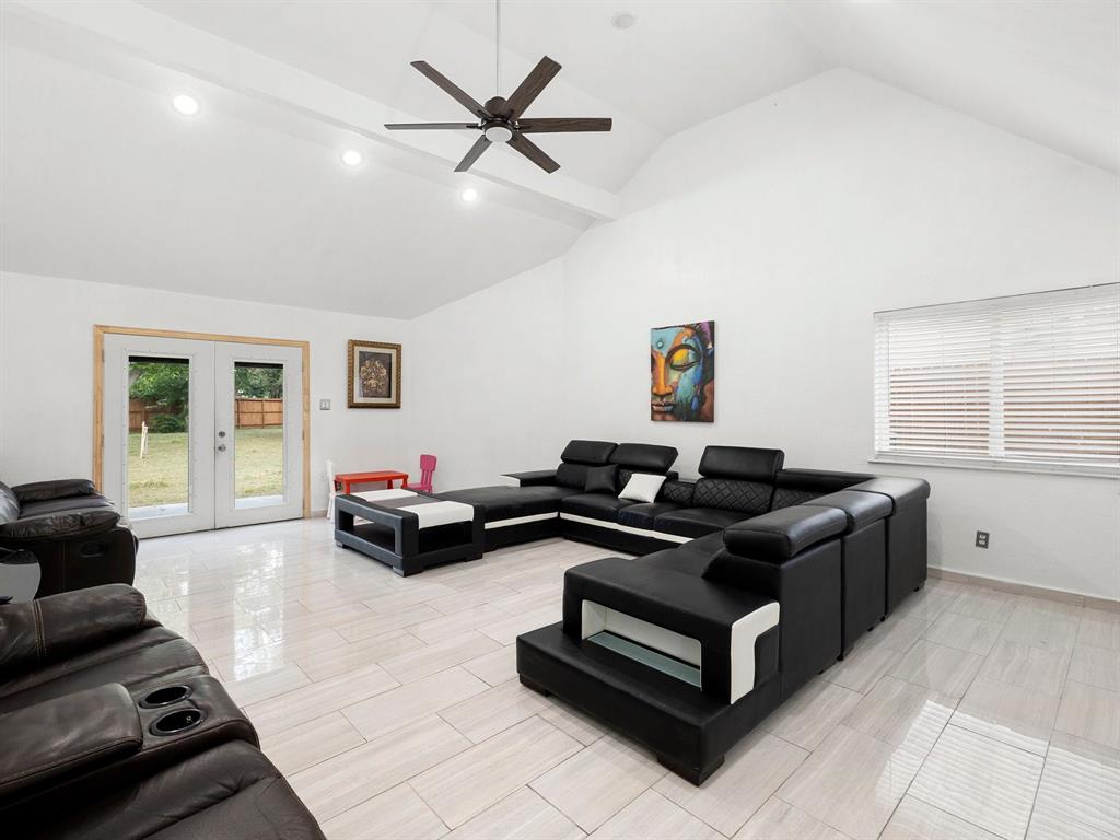 a living room with furniture and a window