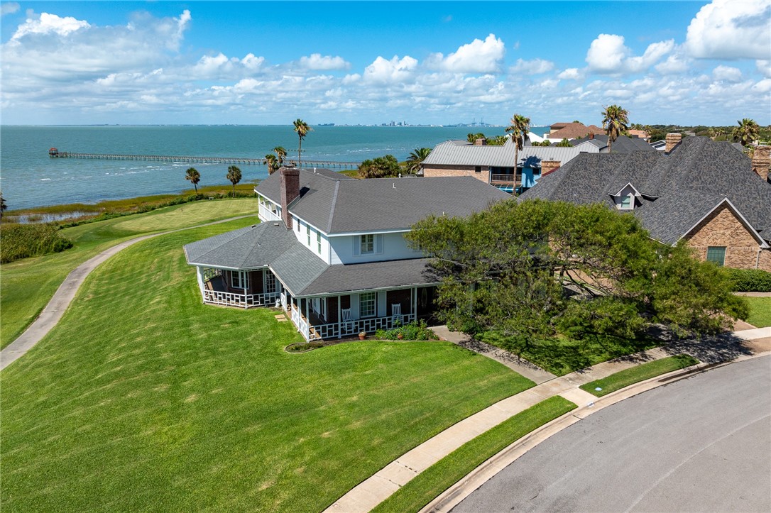 an aerial view of multiple houses with yard