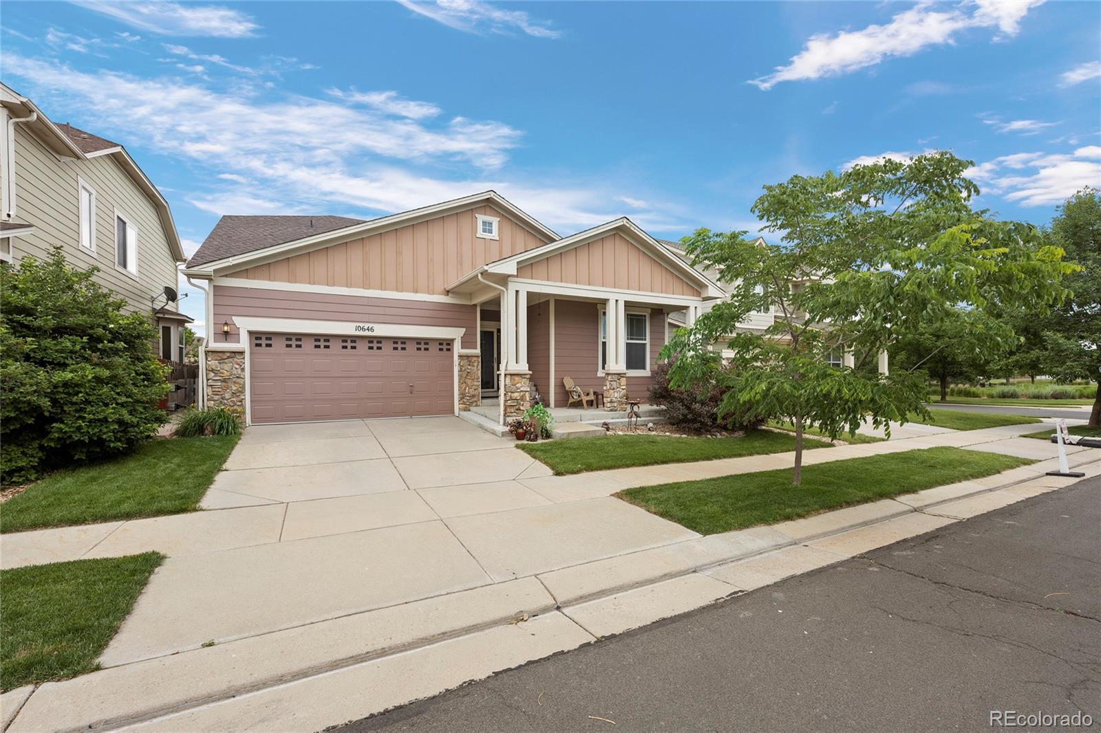 a front view of a house with yard