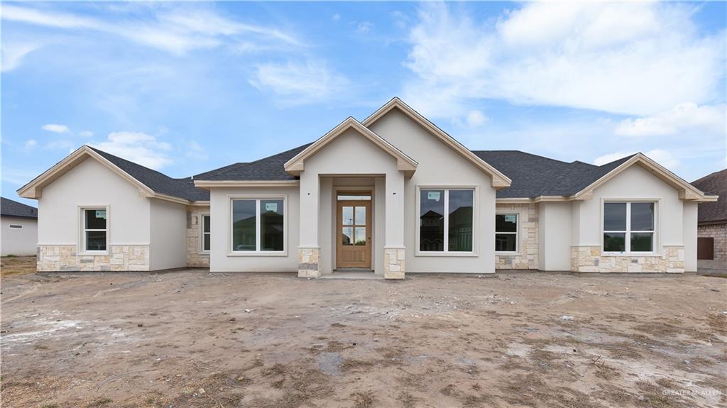 front view of a house with a yard