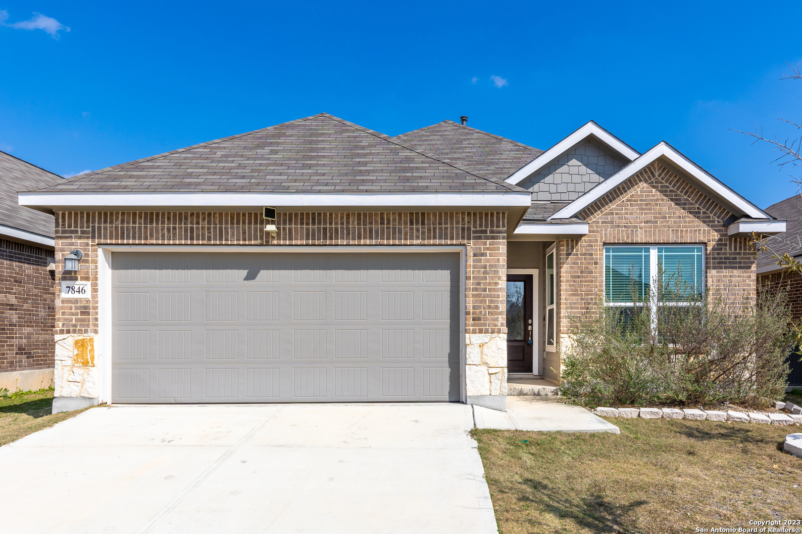 a front view of a house with yard