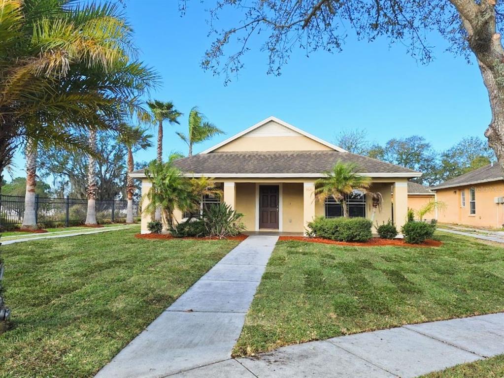 a front view of a house with a yard