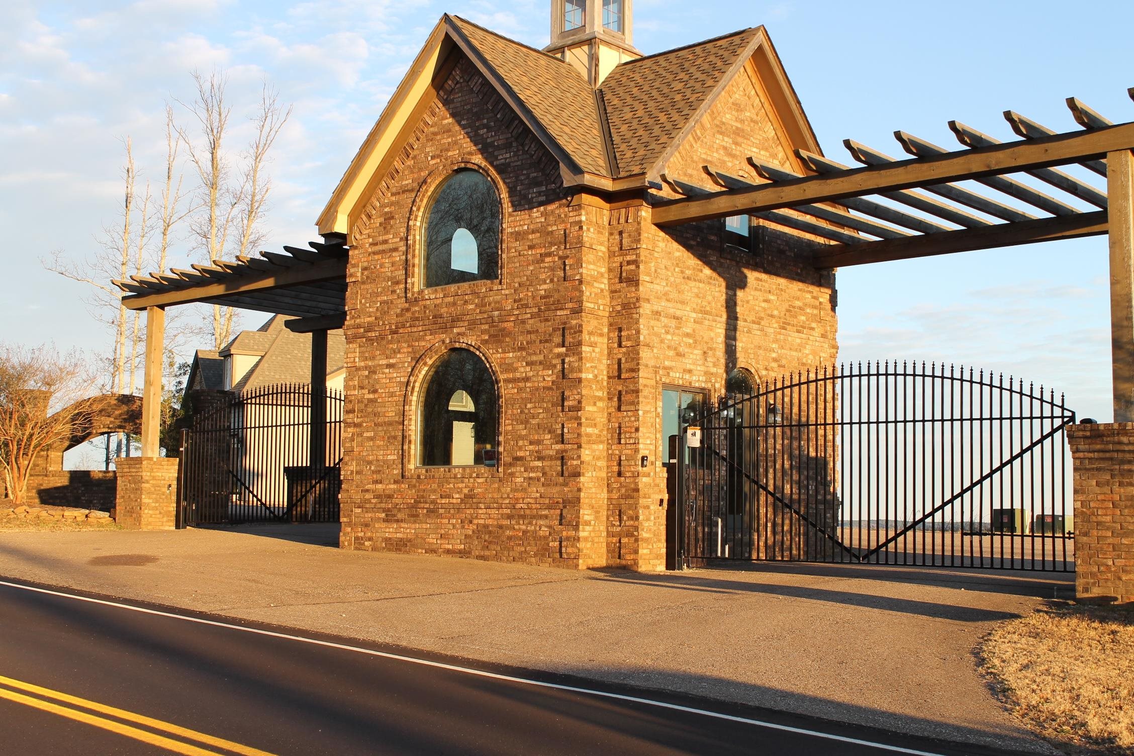 a view of a brick house with iron stairs