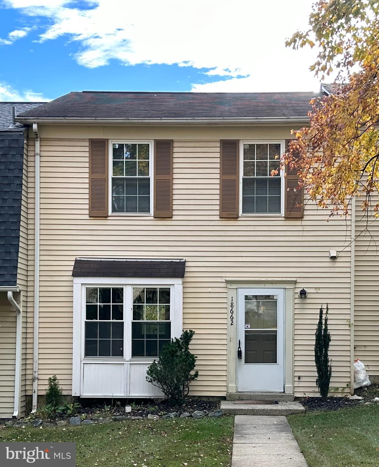 a front view of a house with a yard