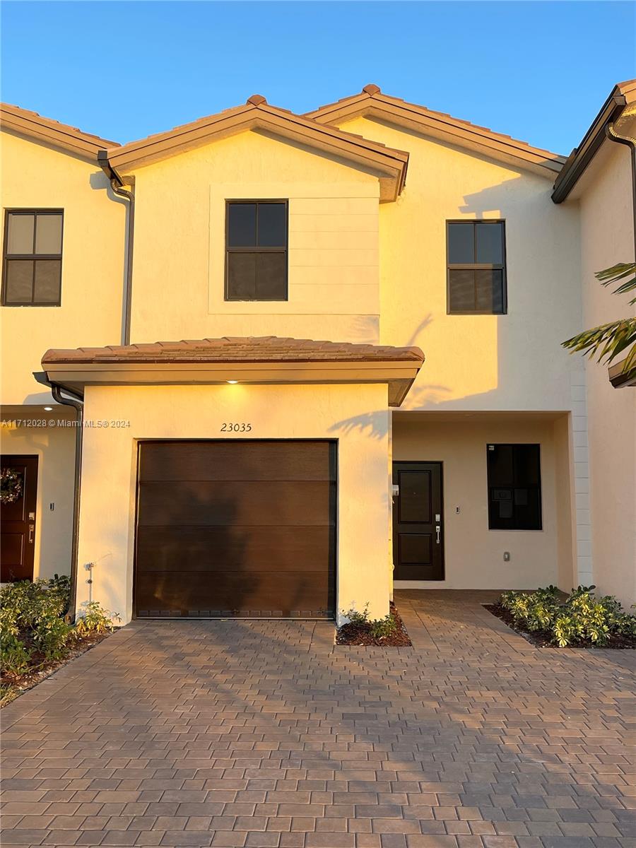 a front view of a house with yard