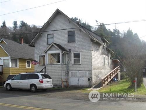 a car parked in front of a house