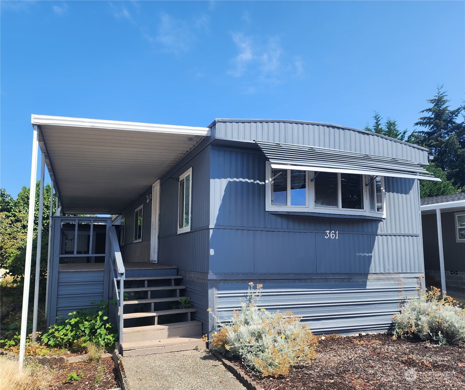 a front view of a house with a garage