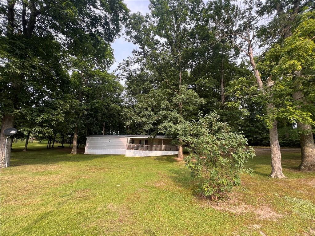 a swimming pool with trees in the background