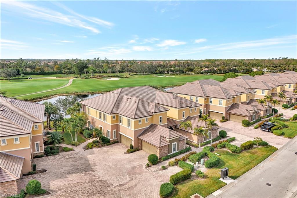 an aerial view of a house with garden space and ocean view