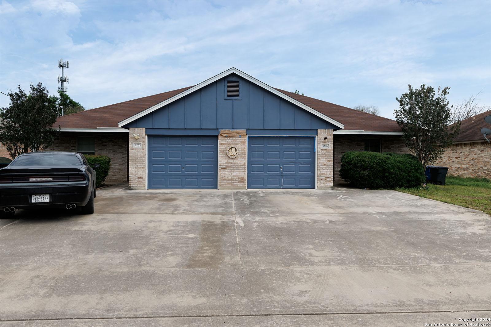 a car parked in front of a house