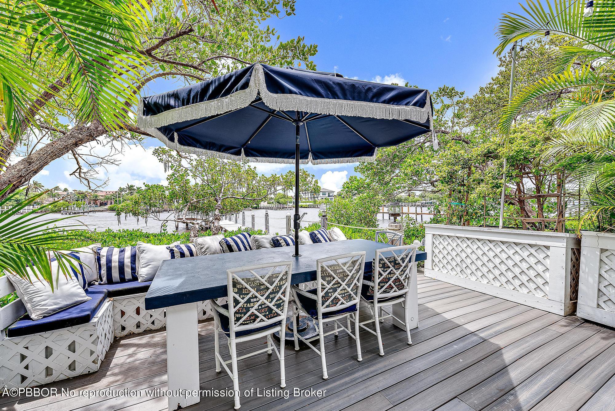 a view of an outdoor sitting area with furniture