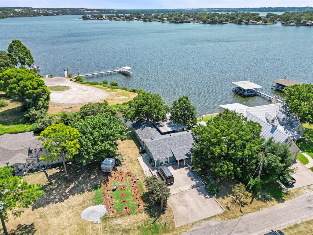 an aerial view of a houses with ocean view