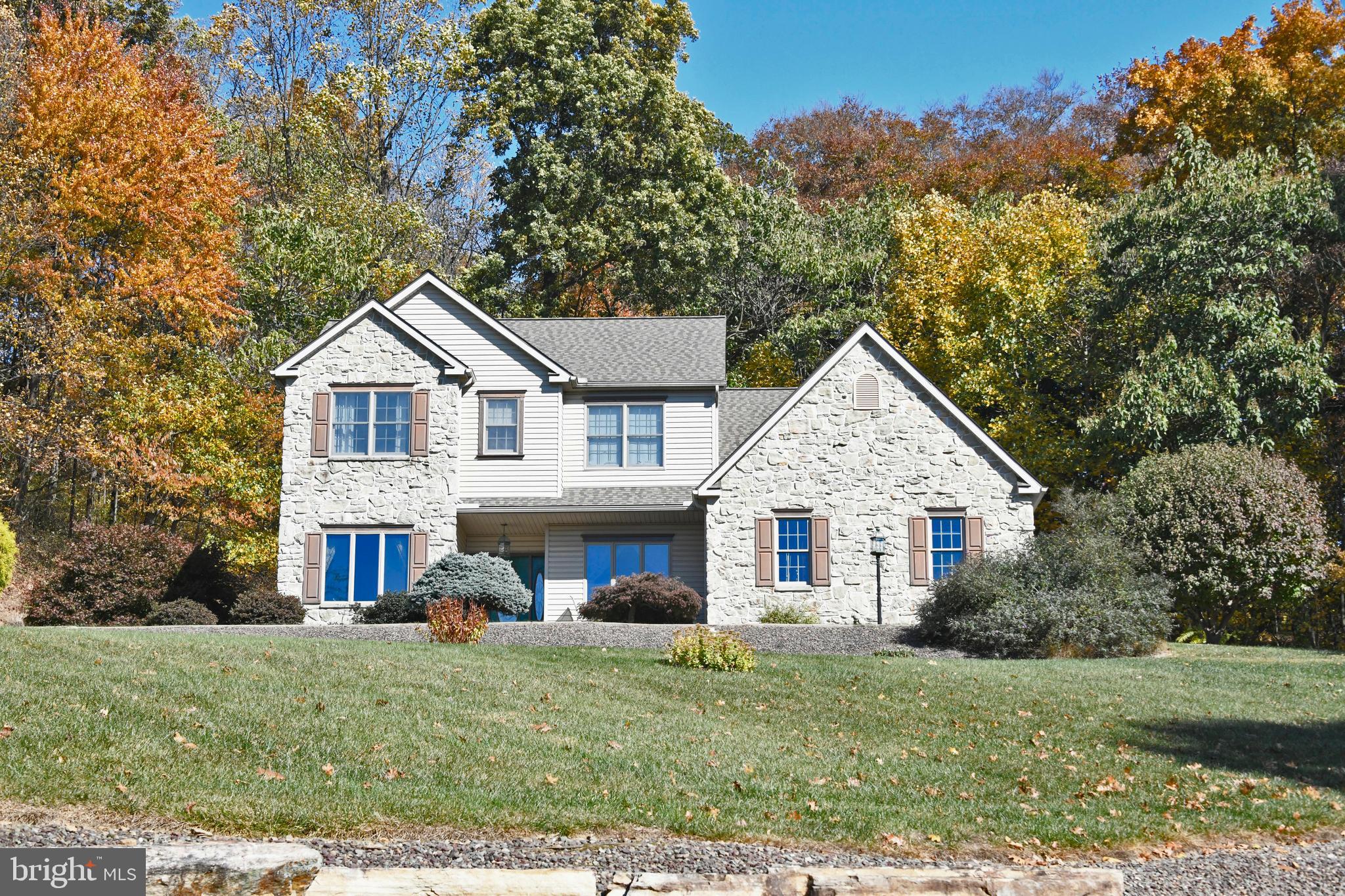 a view of house that has a yard