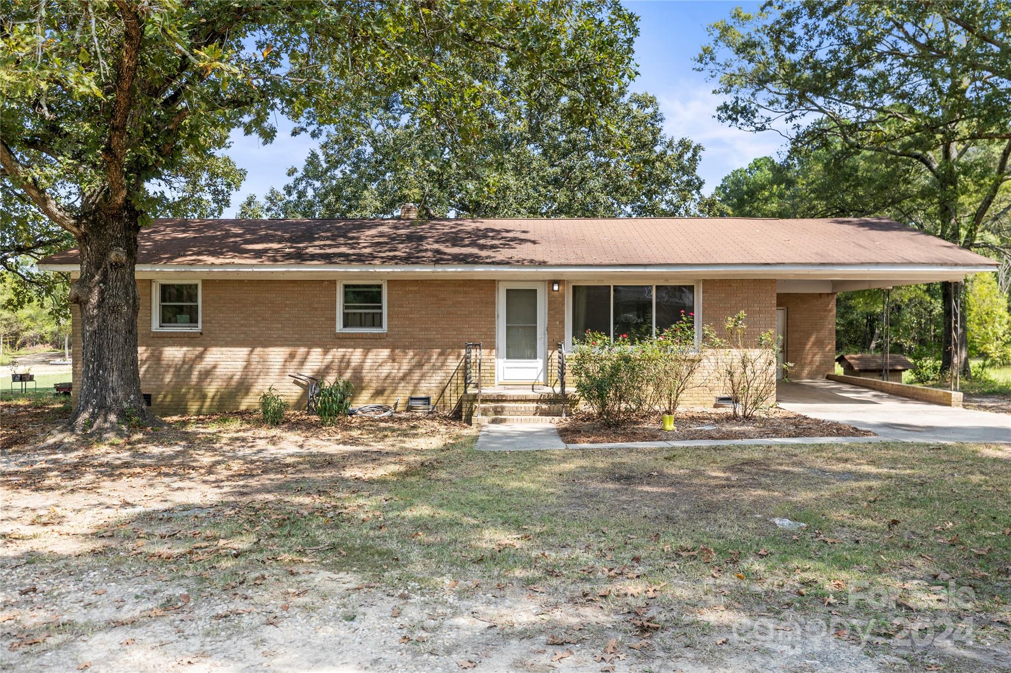 a front view of house with yard patio and green space