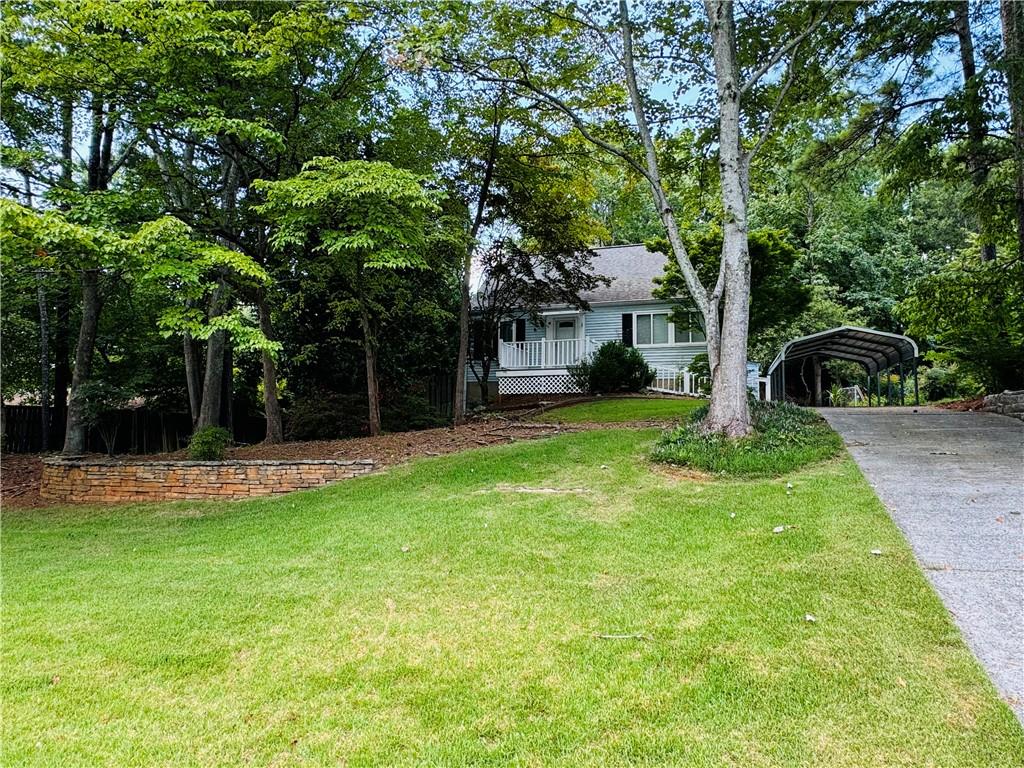 a view of a house with a yard