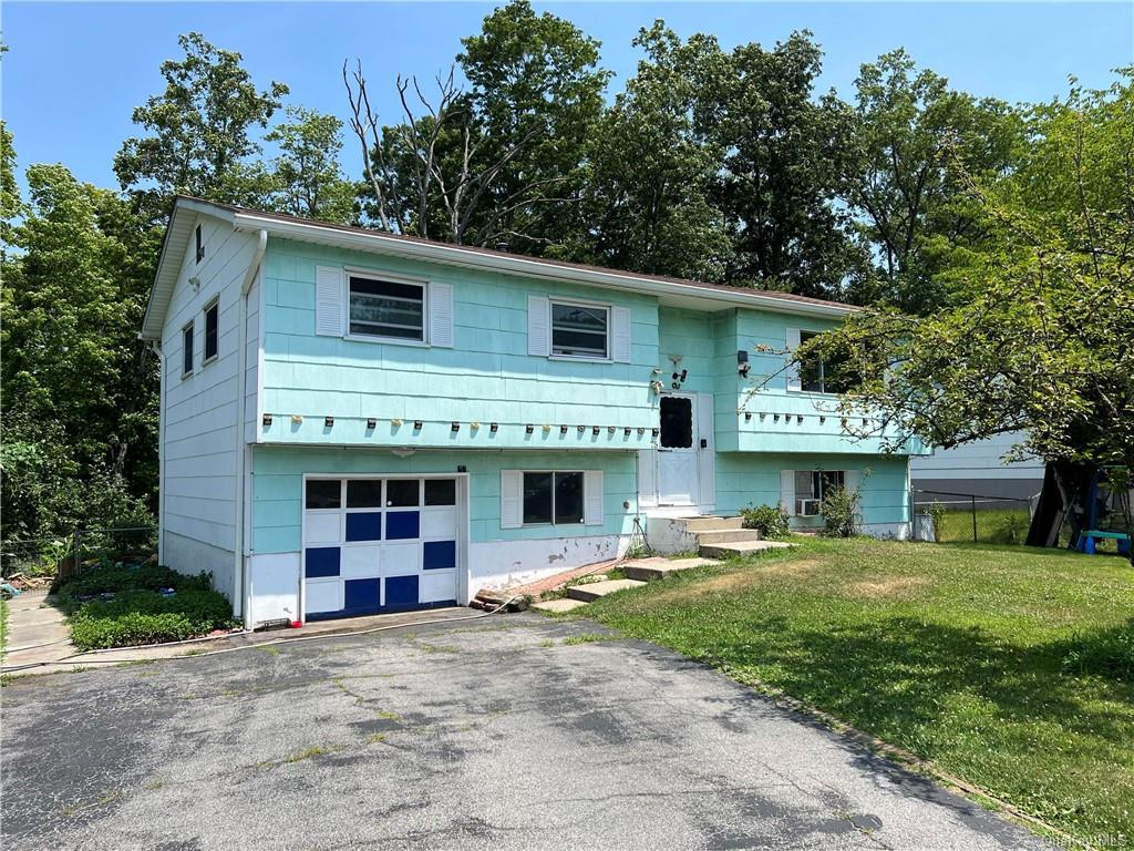 Bi-level home with a front yard