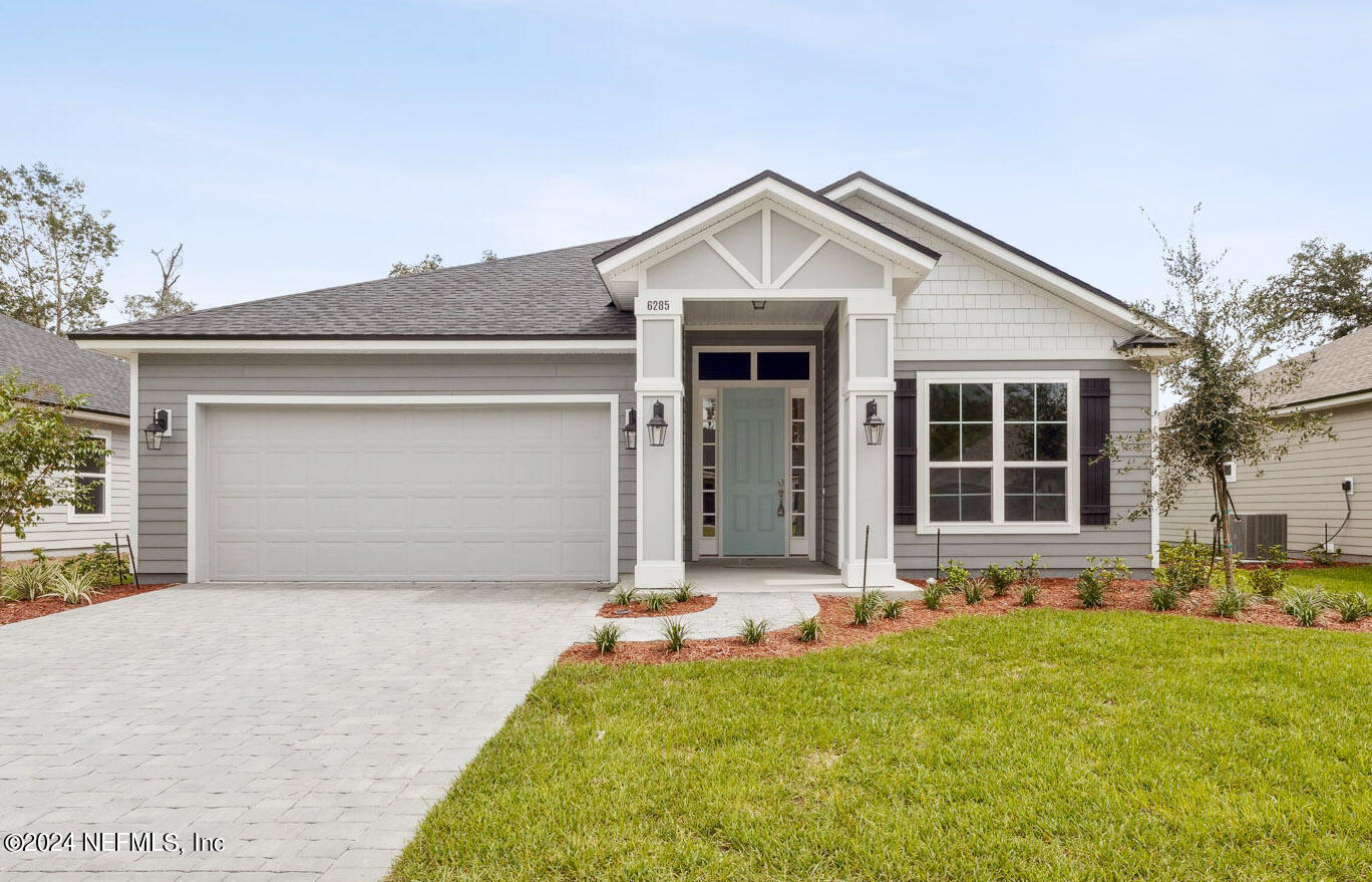 front view of house with a yard