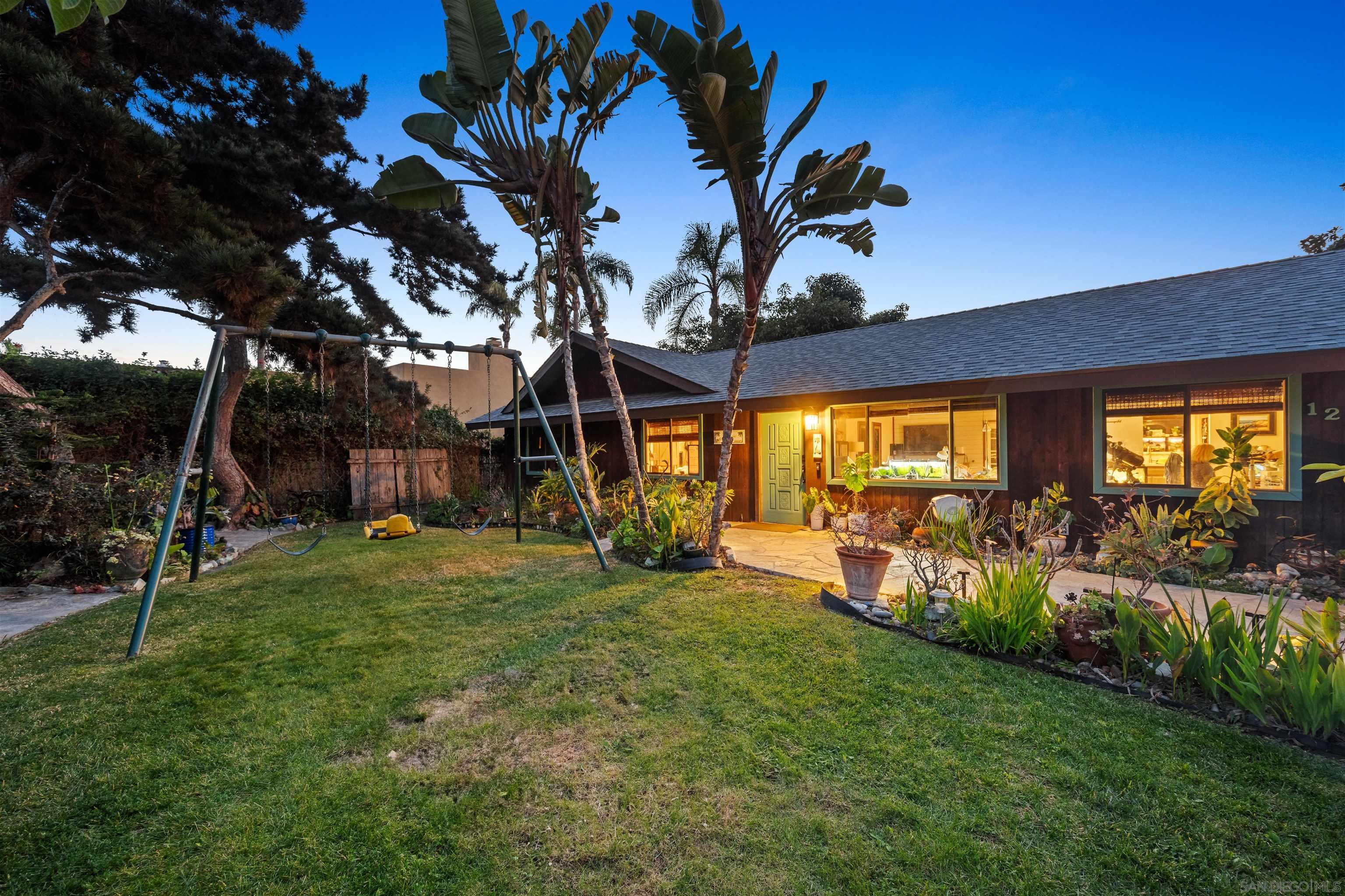 a view of a backyard of the house