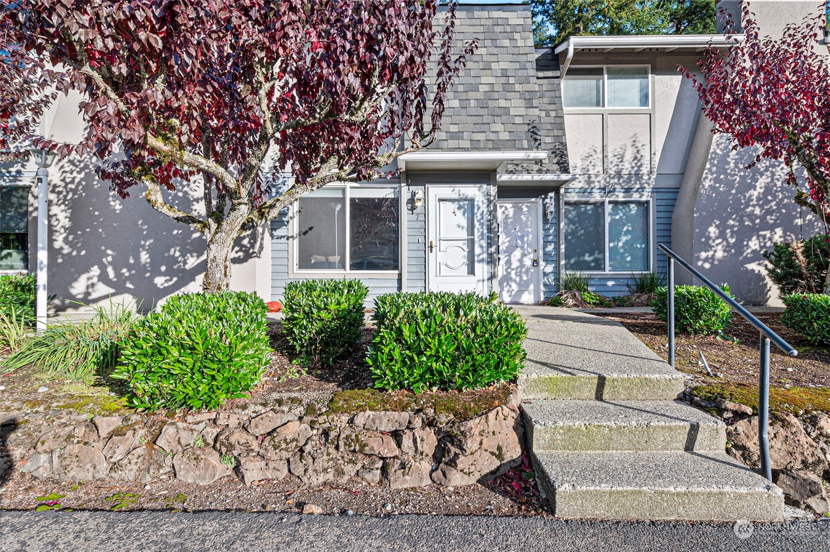 a front view of a house with garden