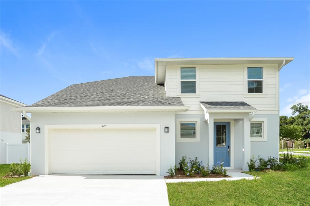 a view of a house with a yard