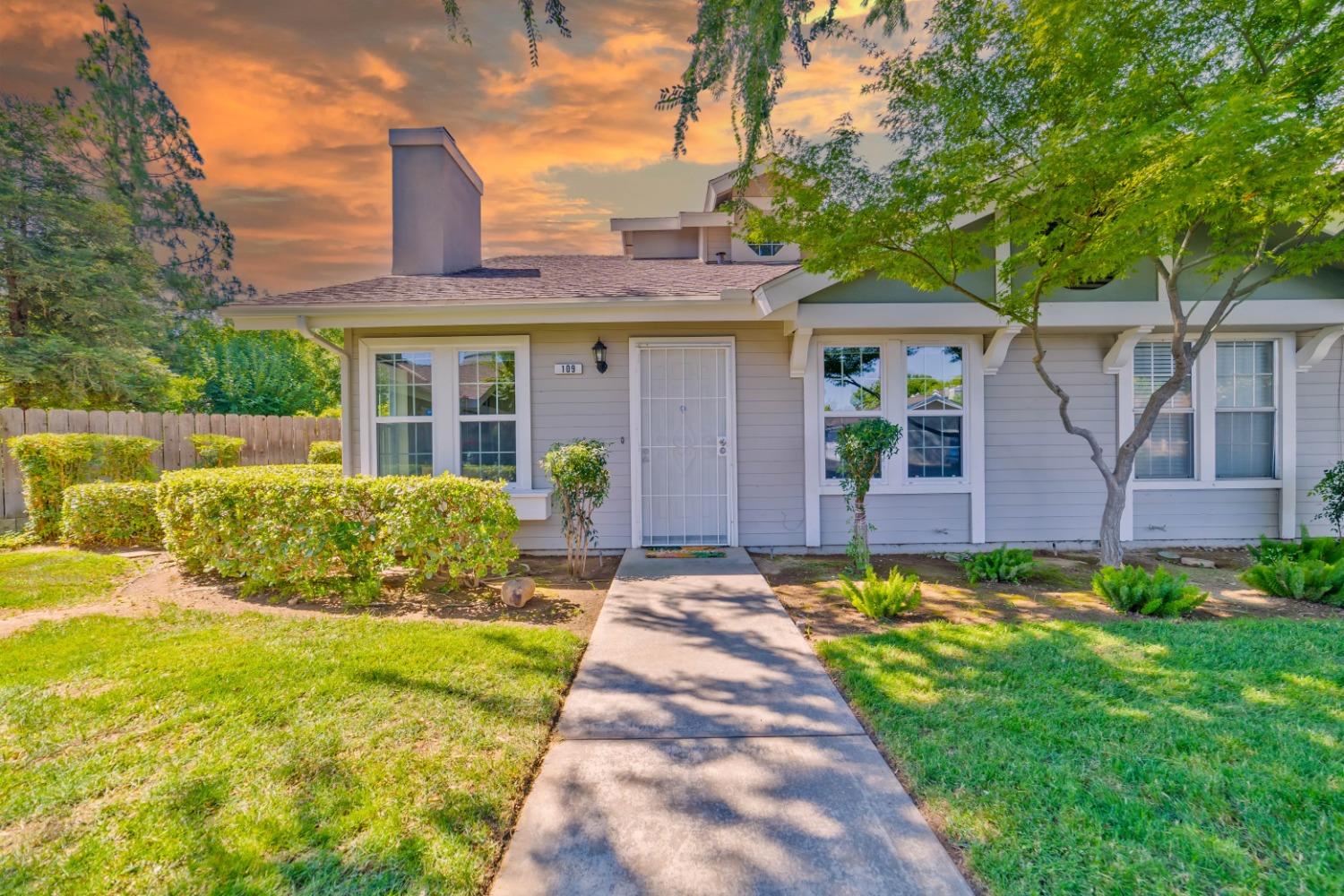 a front view of a house with garden