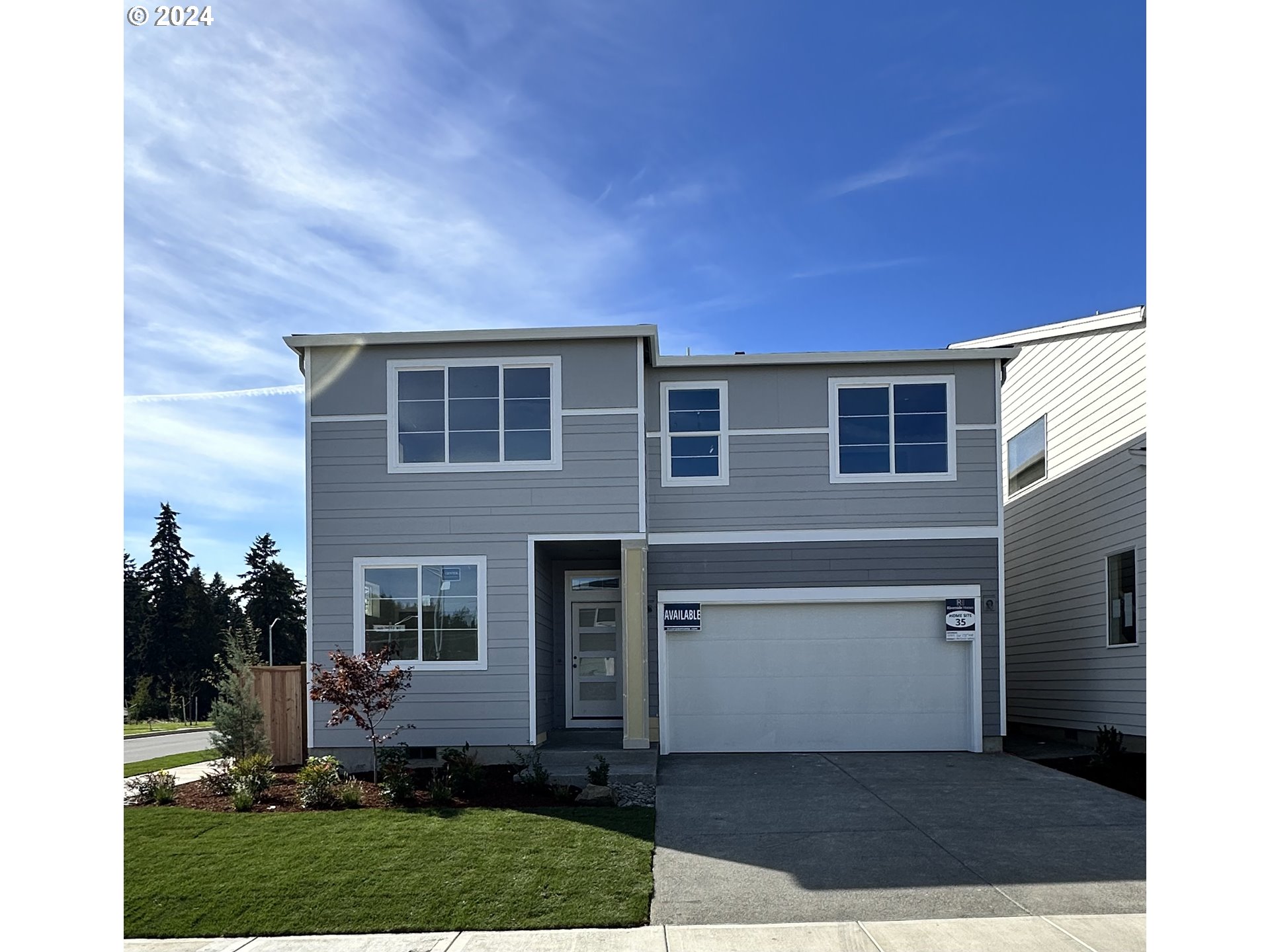 front view of a house with a yard