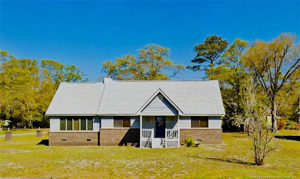 front view of a house with a yard