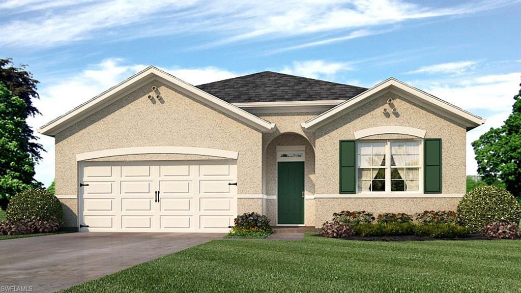 View of front of home with a garage and a front yard