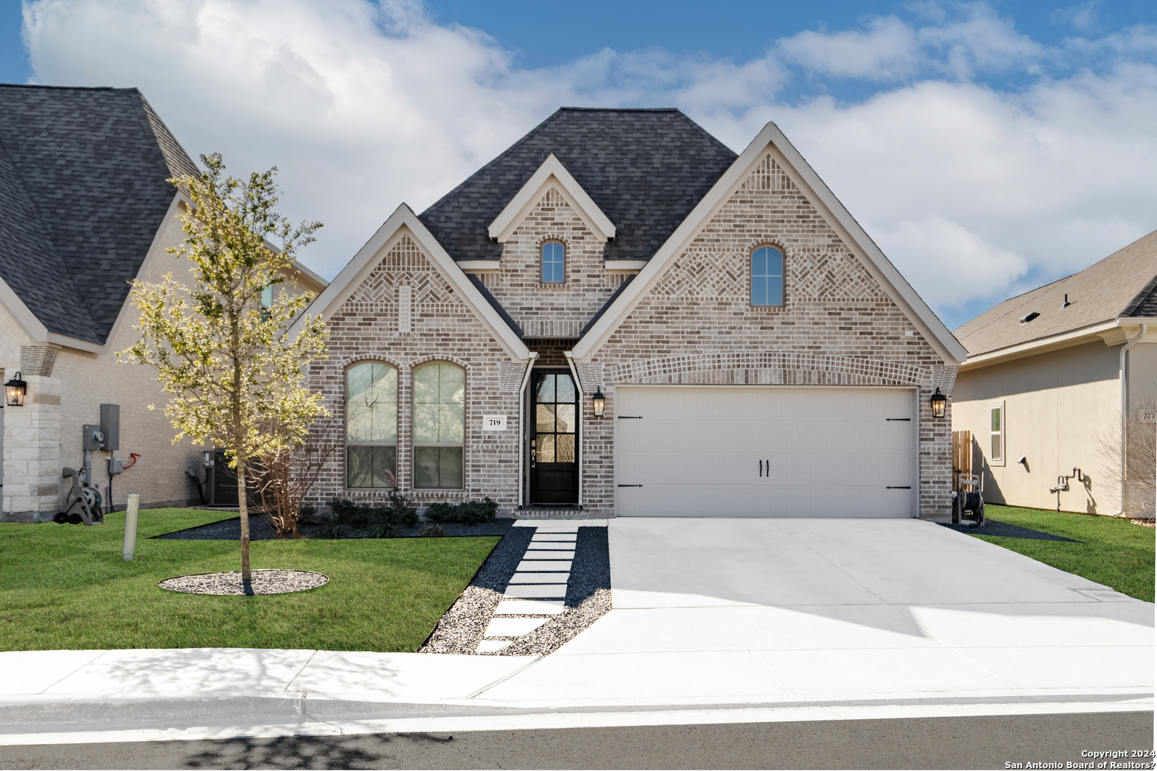 a front view of a house with a yard