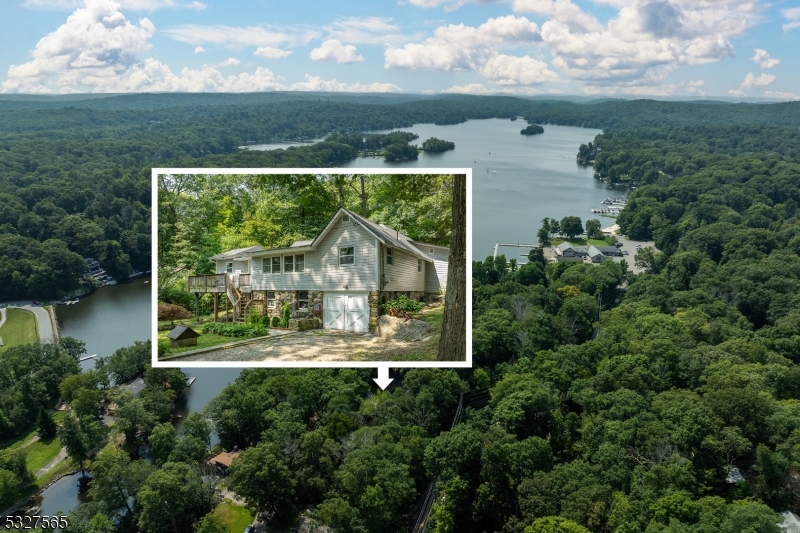 an aerial view of a house with pool outdoor seating and yard