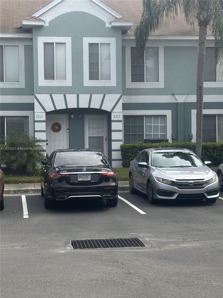 a car parked in front of a house