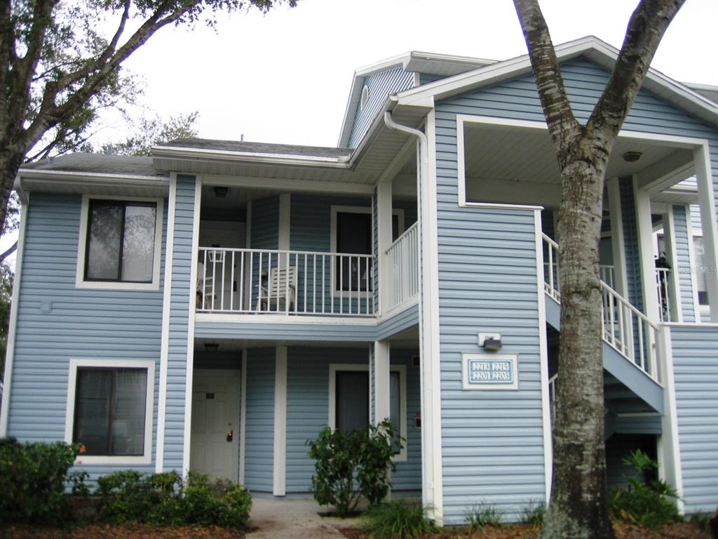 a front view of a house with plants