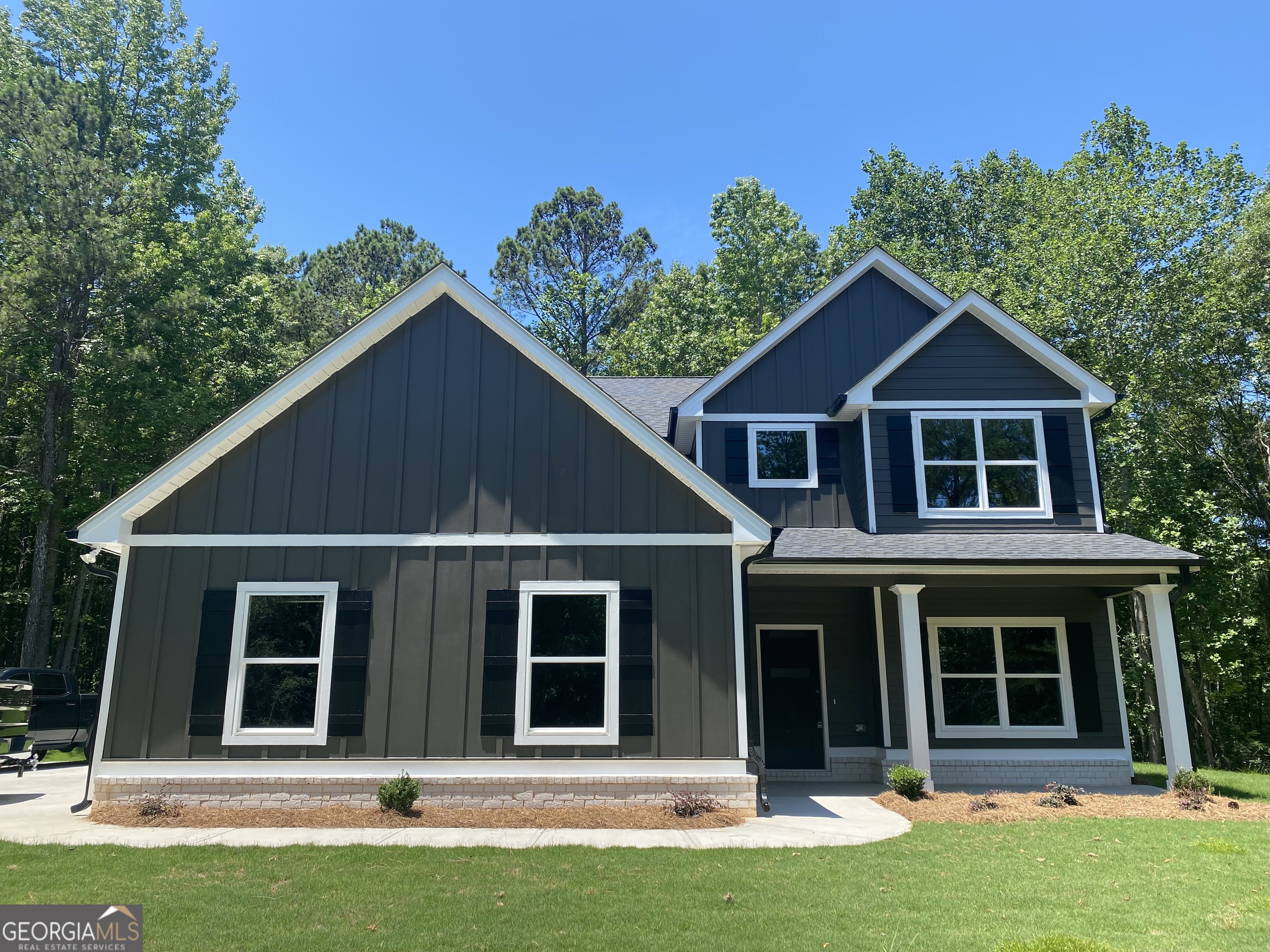 front view of a house with a yard